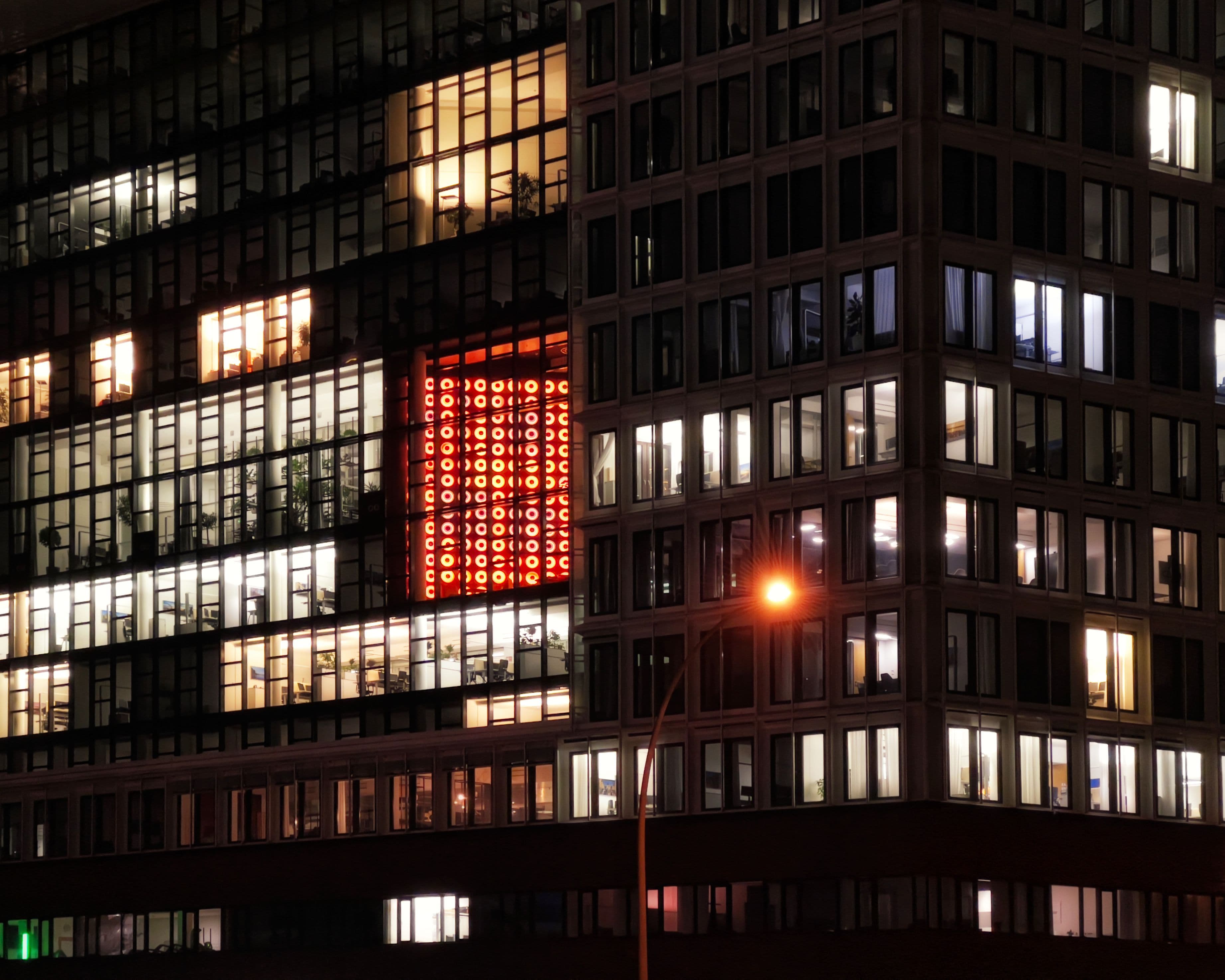 City lights through an office window at night