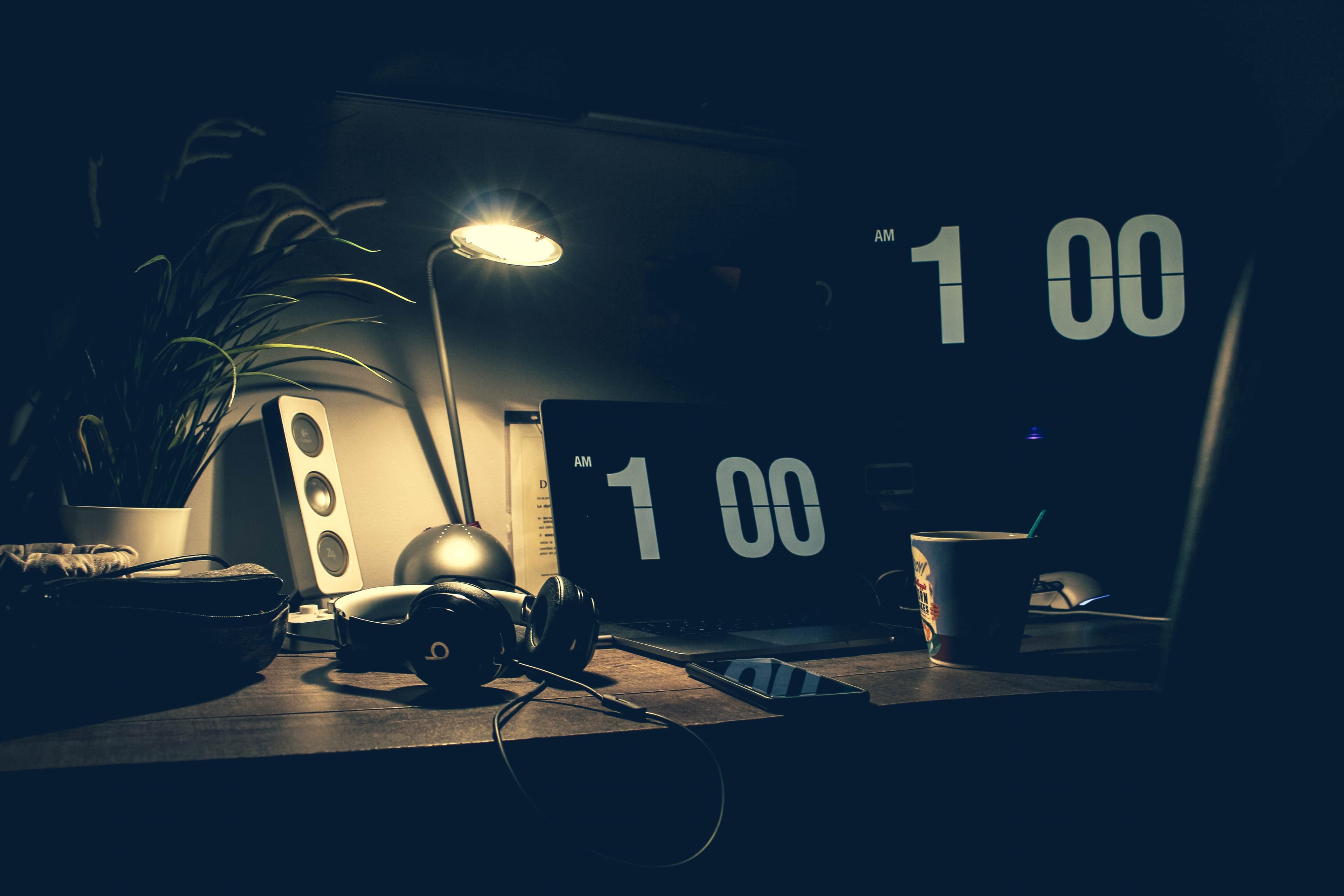 Laptop on a desk in low light — late-night job search